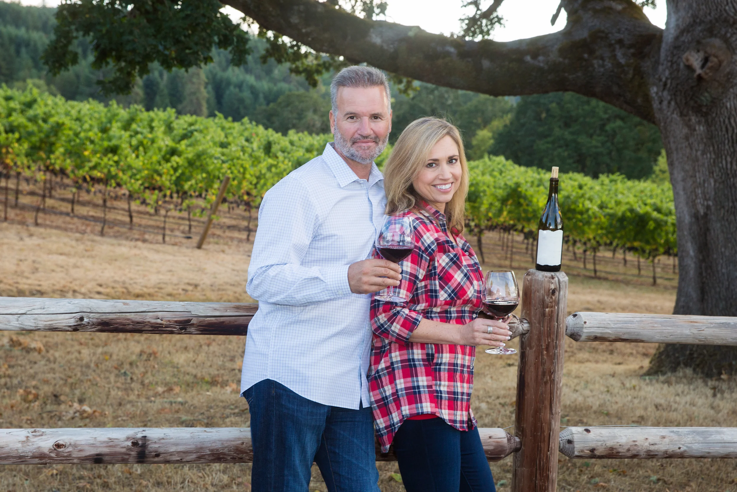 Couple enjoys wine in a vineyard